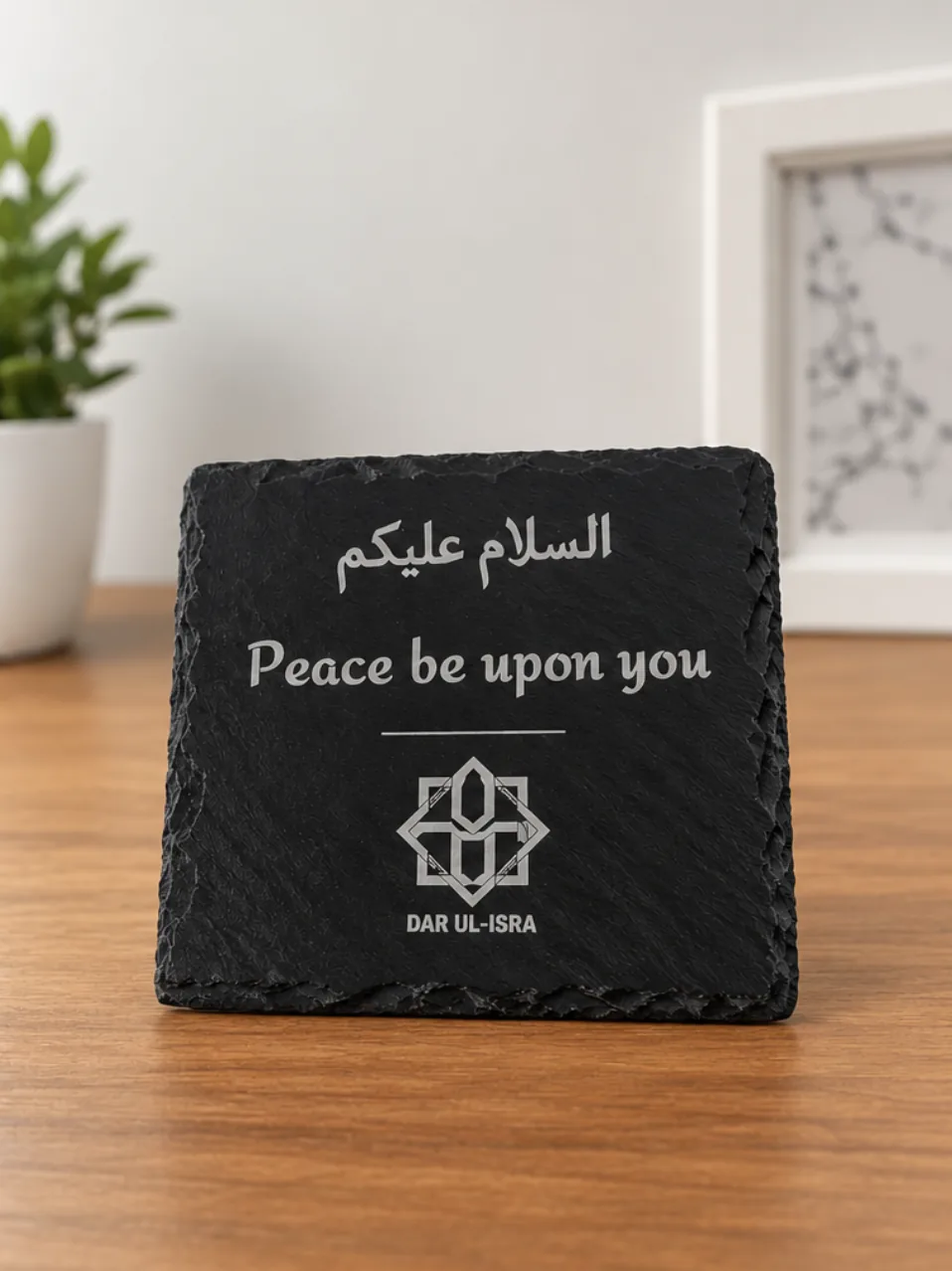 Square slate coaster engraved “السلام عليكم — Peace be upon you” with an organisation’s logo