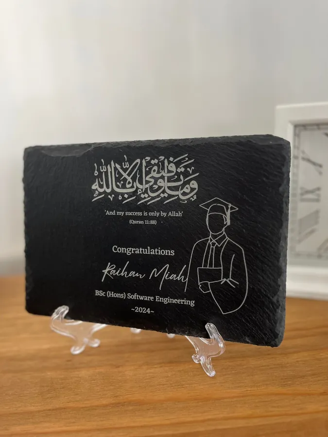 Graduation slate on a wooden sideboard